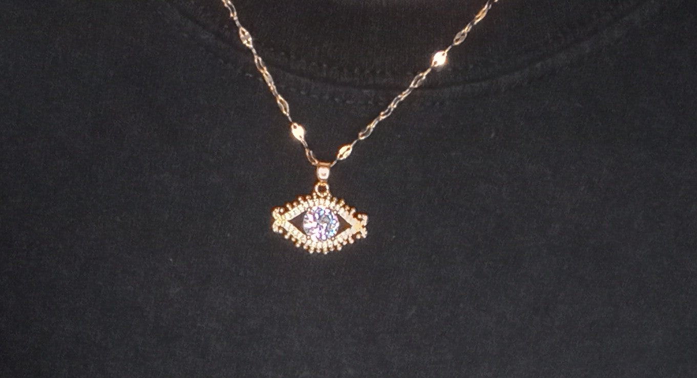 Gold eye necklace with large stone